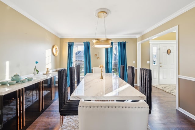 dining space with baseboards, ornamental molding, and dark wood-type flooring