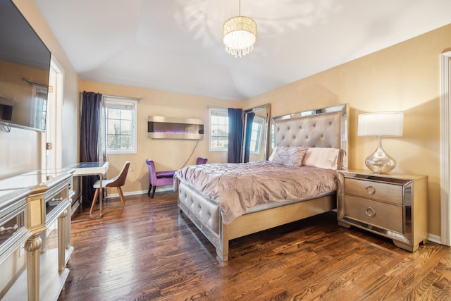 bedroom with dark wood-style floors, baseboards, vaulted ceiling, and an inviting chandelier