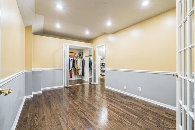 spare room with recessed lighting, french doors, baseboards, and wood finished floors