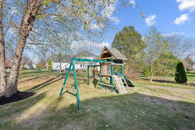 view of jungle gym featuring a lawn