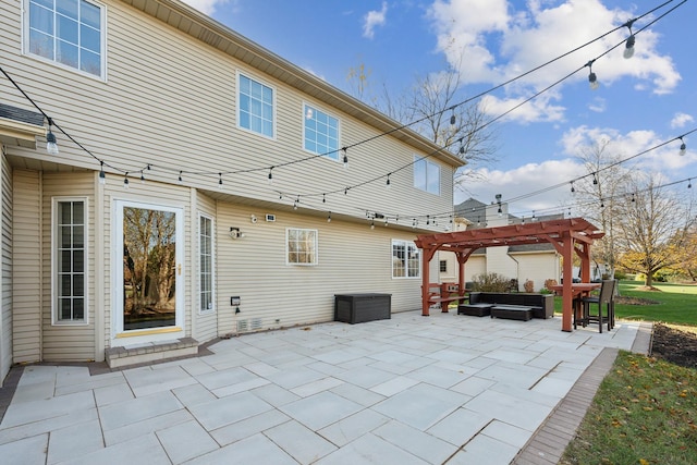 rear view of house featuring a patio area, outdoor lounge area, and a pergola