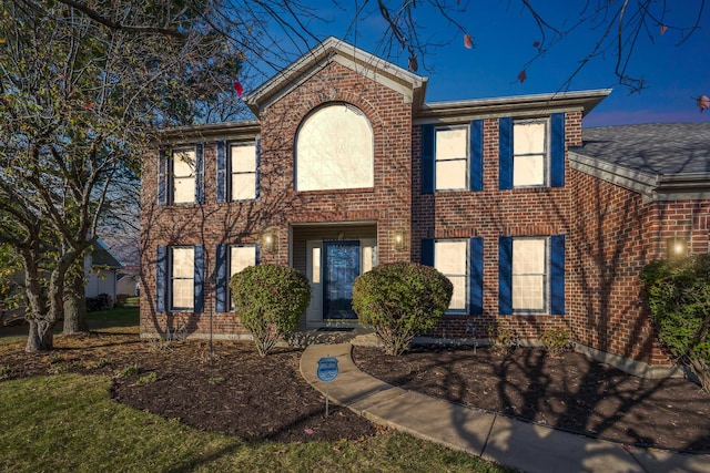 colonial house with brick siding