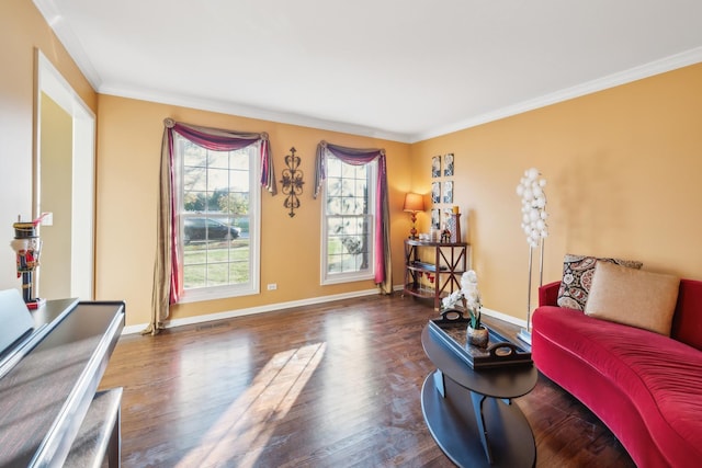 living area with ornamental molding, baseboards, and wood finished floors