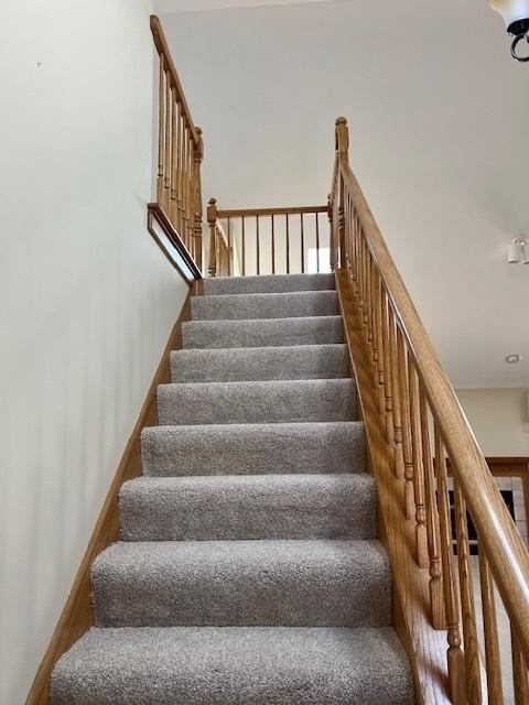 stairs featuring baseboards