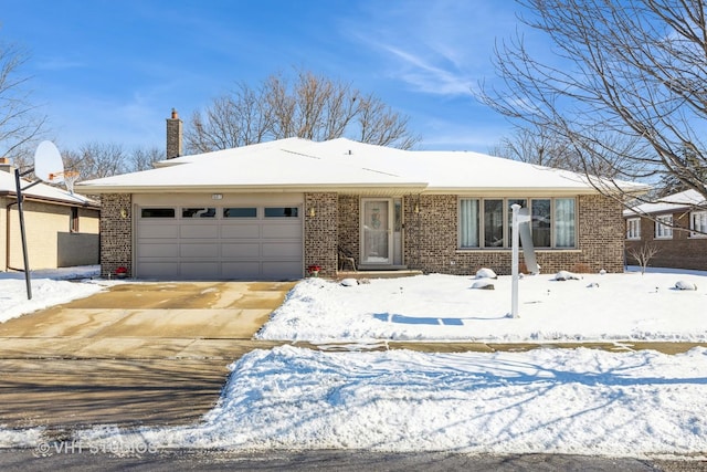 ranch-style house with brick siding, driveway, a chimney, and an attached garage