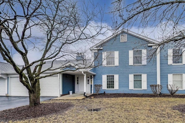 view of front of home with driveway and an attached garage