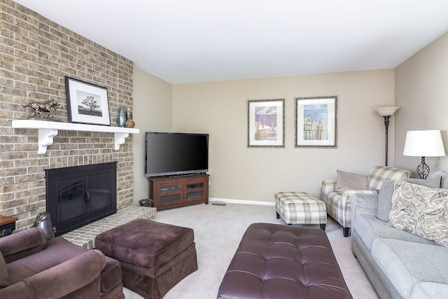 carpeted living room featuring a fireplace and baseboards