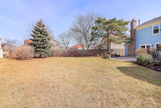 view of yard with a patio and fence