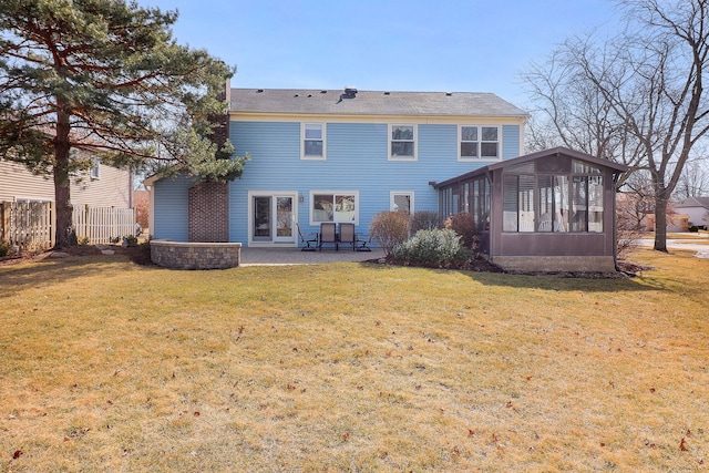 back of property featuring a patio, a yard, fence, and a sunroom