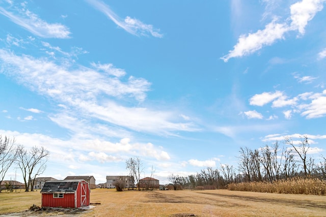 exterior space with a storage unit and an outbuilding