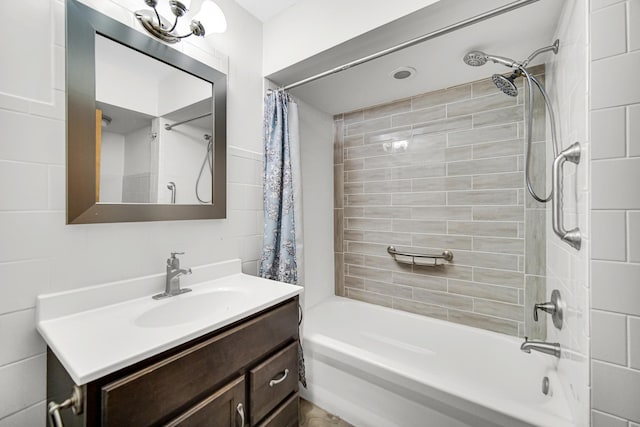 bathroom featuring shower / tub combo and vanity