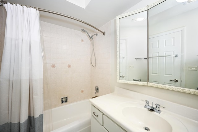 bathroom featuring vanity and shower / tub combo with curtain