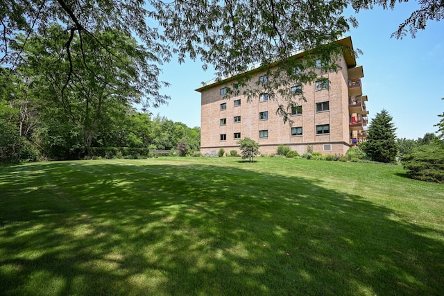 view of building exterior featuring uncovered parking
