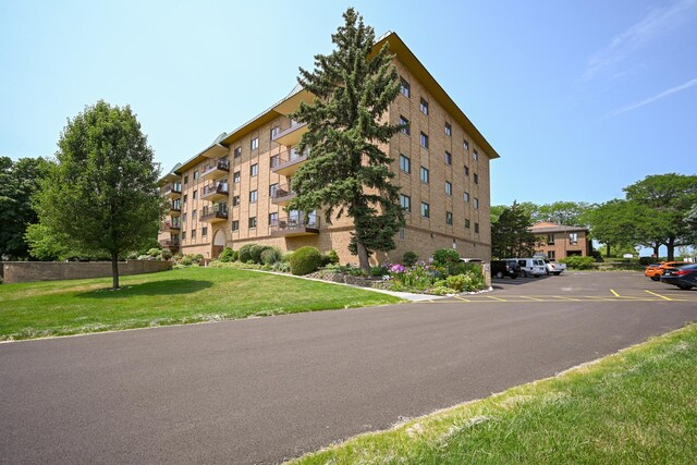 view of property with uncovered parking