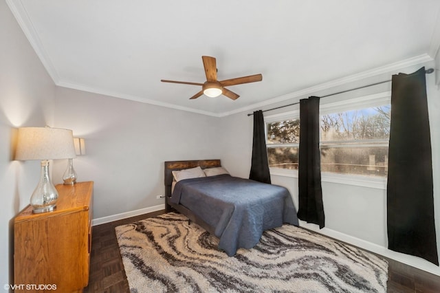 bedroom with crown molding, baseboards, and ceiling fan