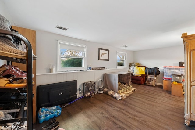 interior space with wood finished floors and visible vents