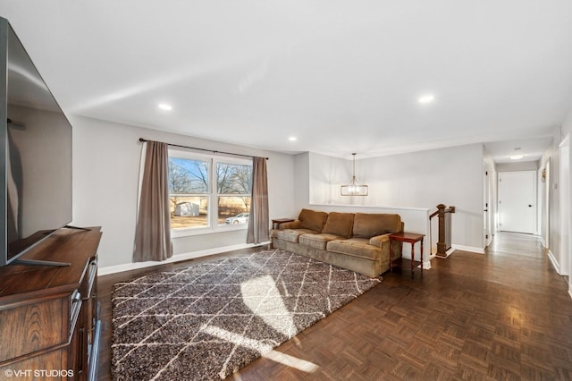 living area with baseboards and recessed lighting