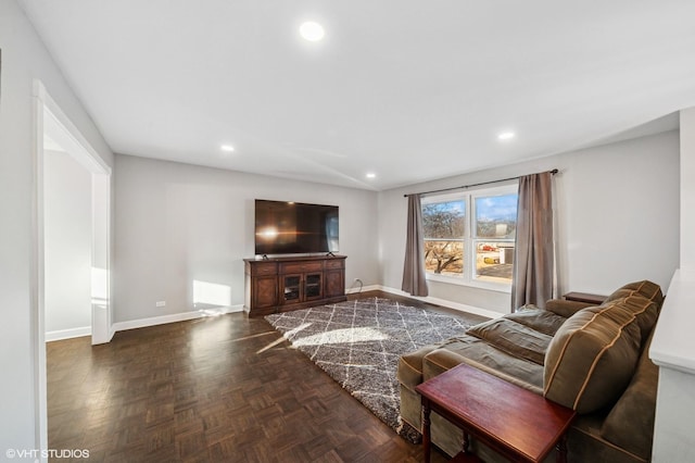 living room with recessed lighting and baseboards