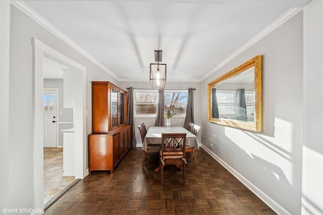 dining room with baseboards and ornamental molding