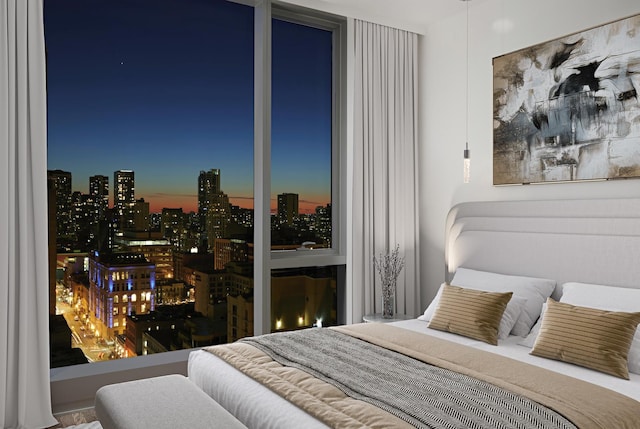 bedroom featuring a view of city