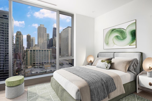 bedroom with a view of city, a wall of windows, and wood finished floors