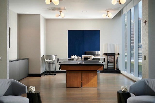 office area with baseboards, dark wood finished floors, and floor to ceiling windows