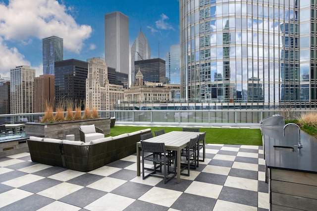 view of patio / terrace with outdoor dining area, a view of city, and an outdoor living space