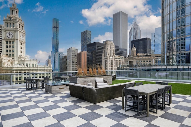 view of patio / terrace featuring a view of city and an outdoor hangout area