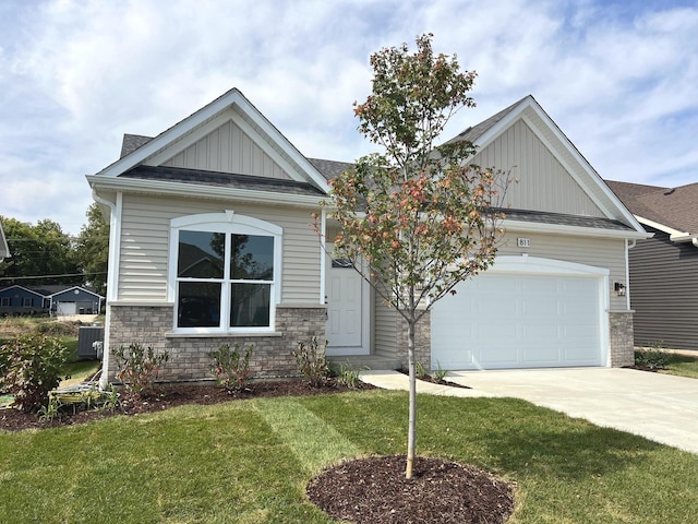 craftsman inspired home featuring a shingled roof, concrete driveway, board and batten siding, a front yard, and a garage