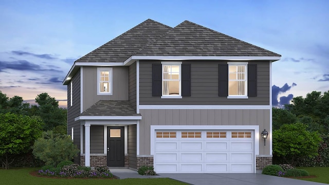 view of front facade with an attached garage, driveway, a shingled roof, and brick siding