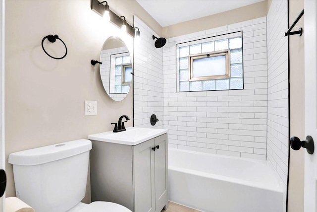 bathroom featuring toilet, washtub / shower combination, and vanity