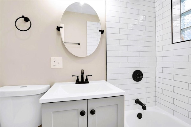 full bathroom featuring shower / washtub combination, vanity, and toilet