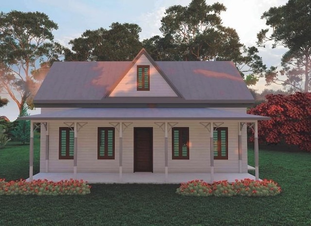 view of front of house featuring a front lawn and a patio area