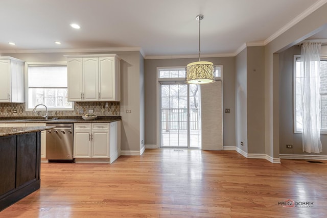 kitchen with decorative backsplash, light wood-type flooring, stainless steel dishwasher, and crown molding