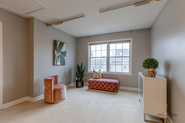 living area with carpet flooring and baseboards