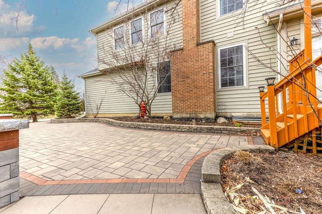 back of property with a patio
