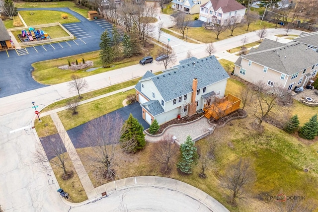 birds eye view of property with a residential view