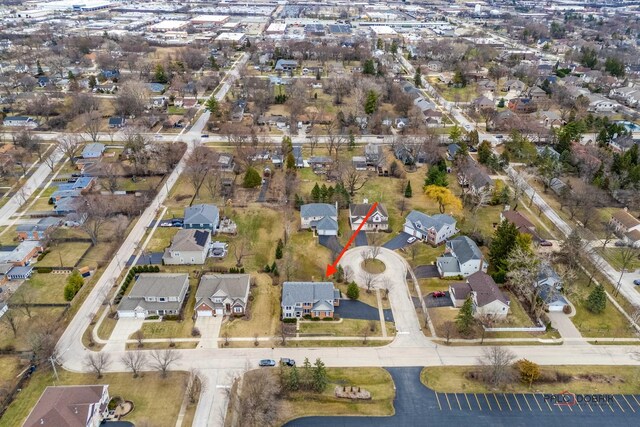 birds eye view of property with a residential view