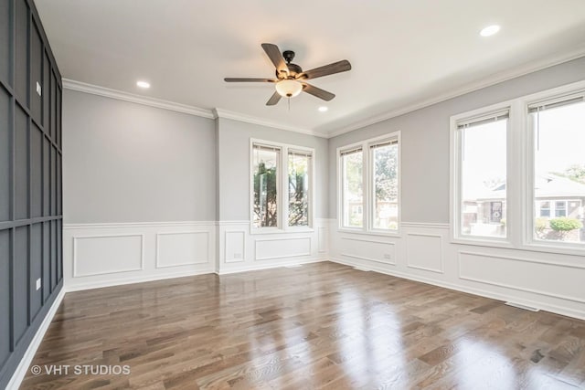 spare room with crown molding, wood finished floors, and recessed lighting