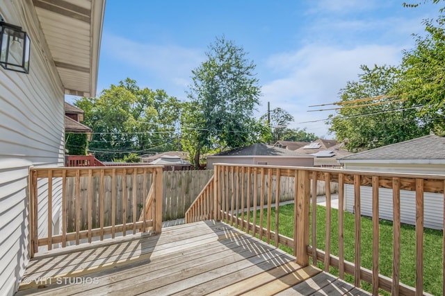 deck with fence and a lawn