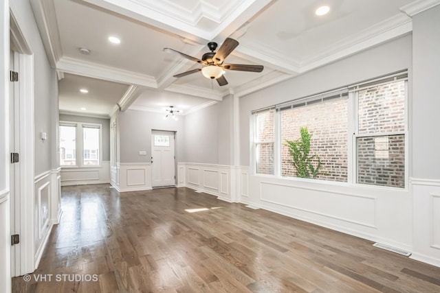 entryway featuring coffered ceiling, wood finished floors, visible vents, ornamental molding, and beamed ceiling