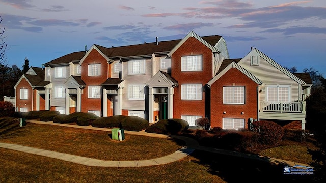 view of front of home featuring brick siding