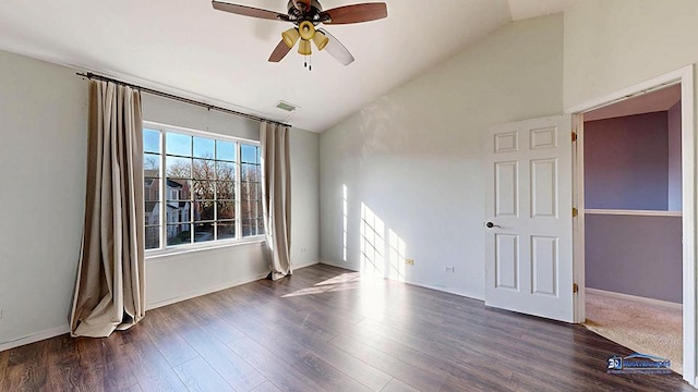 unfurnished room with visible vents, baseboards, ceiling fan, vaulted ceiling, and dark wood-style floors