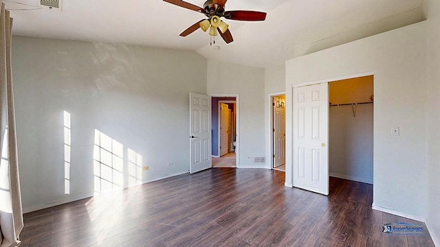 unfurnished bedroom featuring dark wood-style floors, baseboards, visible vents, high vaulted ceiling, and a closet