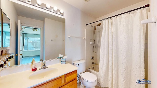 bathroom featuring vanity, toilet, and shower / bathtub combination with curtain