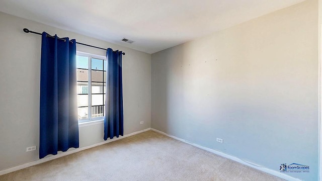 unfurnished room featuring visible vents, baseboards, and carpet