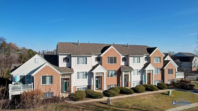 view of front of property featuring a front yard and a residential view