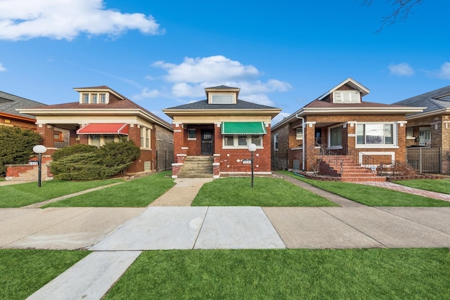 bungalow-style home featuring a front yard and brick siding