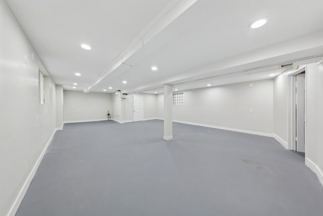 basement featuring recessed lighting and baseboards