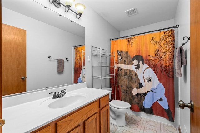 bathroom with curtained shower, visible vents, toilet, vanity, and tile patterned floors